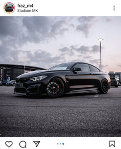 Blacked out BMW M4 with some short tinted 3D gel plates
